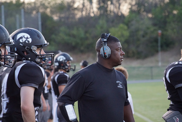 Coach Bruce coordinates the Hawks defense from the sidelines. Photo credit CPS Exodus 2015