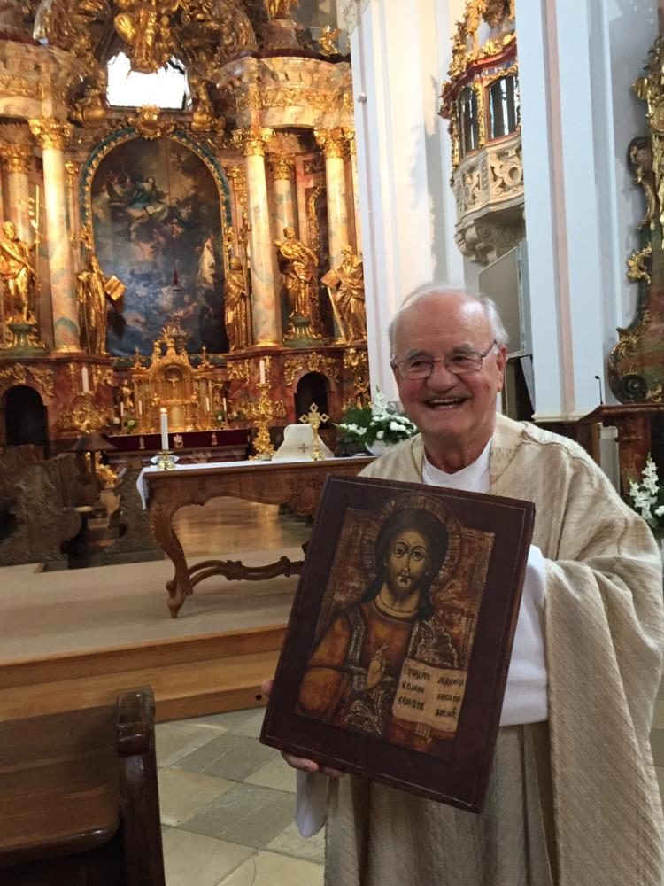 Fr. Bernard, after saying the Mass at the abbey church of Zirc, is holding a 19th century Russian icon he received.